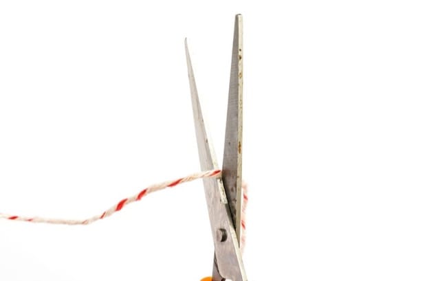 scissors cutting string isolated on white background | Weight Loss and the Waiting Trap | Progress iOS weight loss tracking app